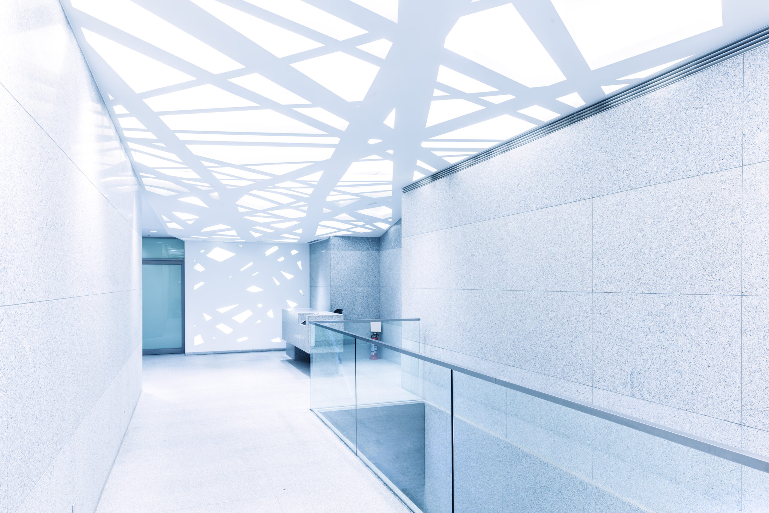 empty corridor with glass railing and abstract ceiling