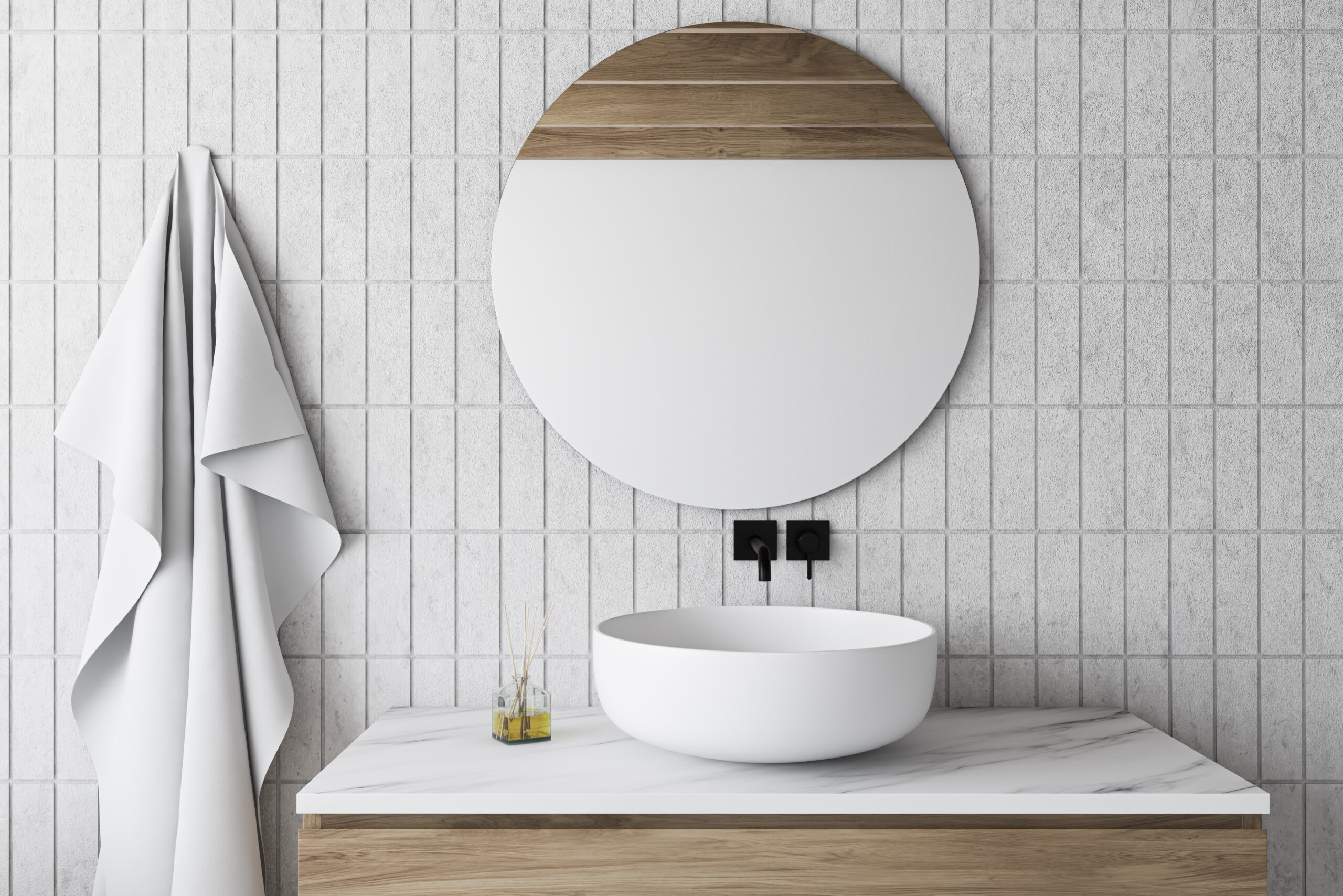 Comfortable sink with round mirror standing on marble and wooden countertop in bathroom with white tile walls. 3d rendering