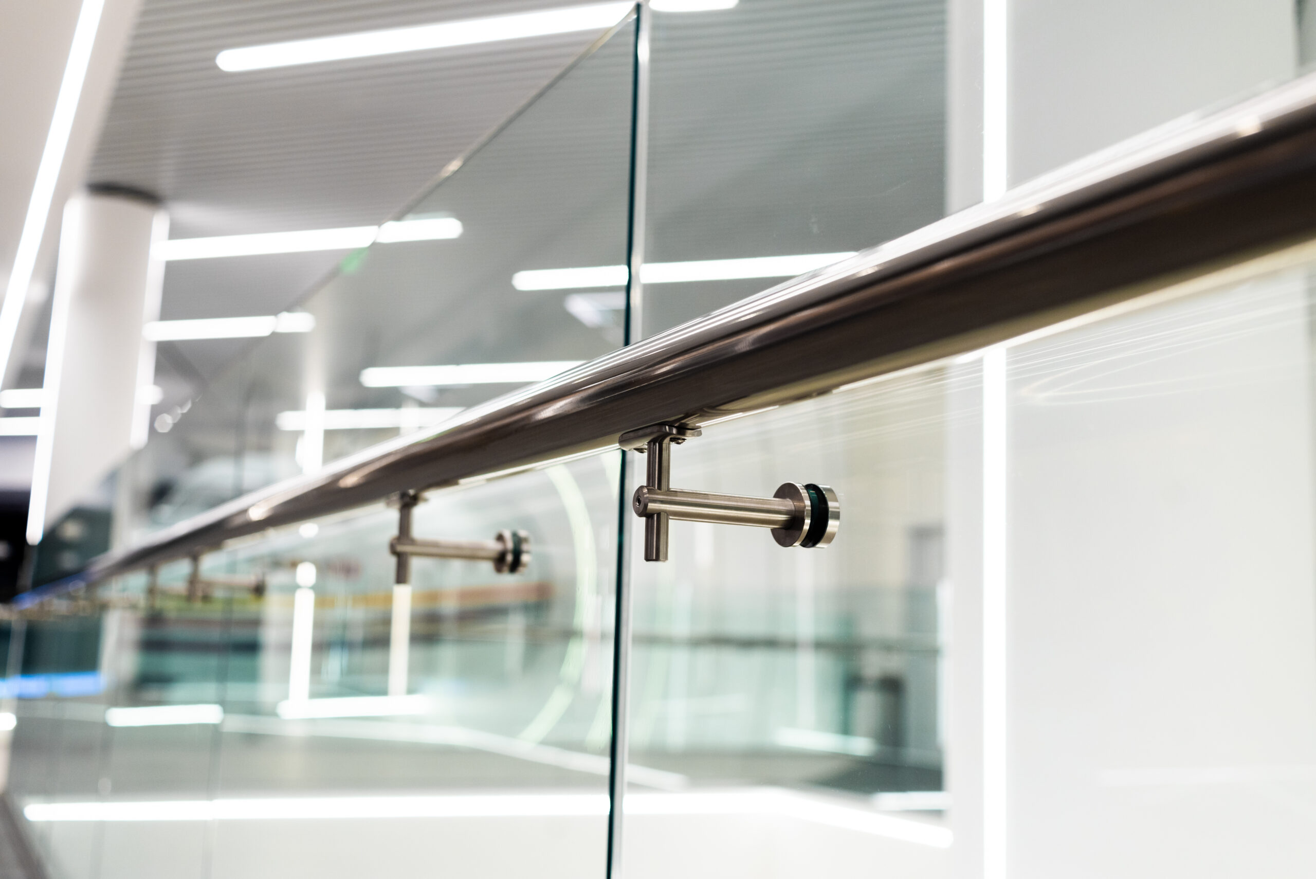 stainless steel railings and glass wall in modern building interior