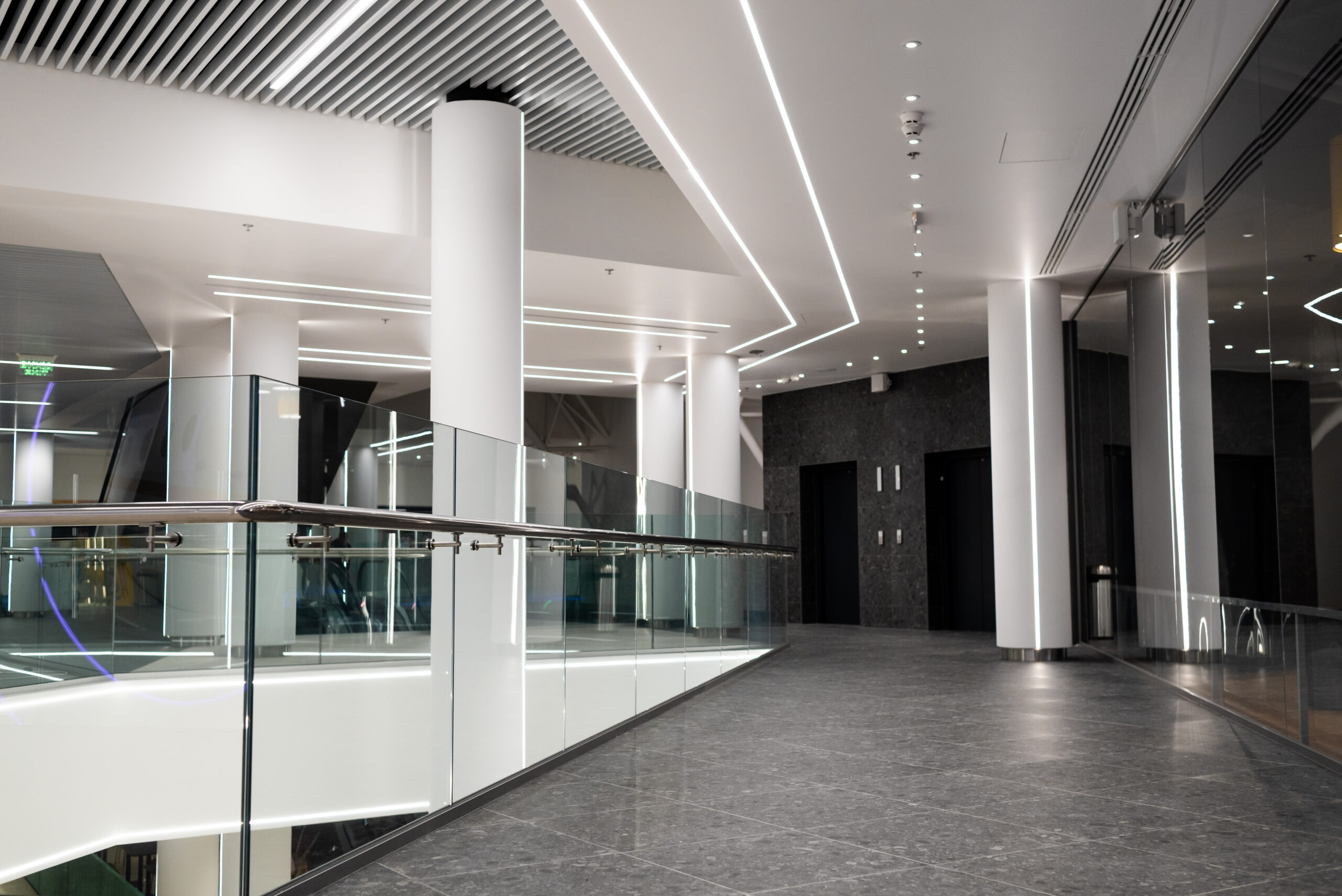 stainless steel railings and glass wall in modern building interior