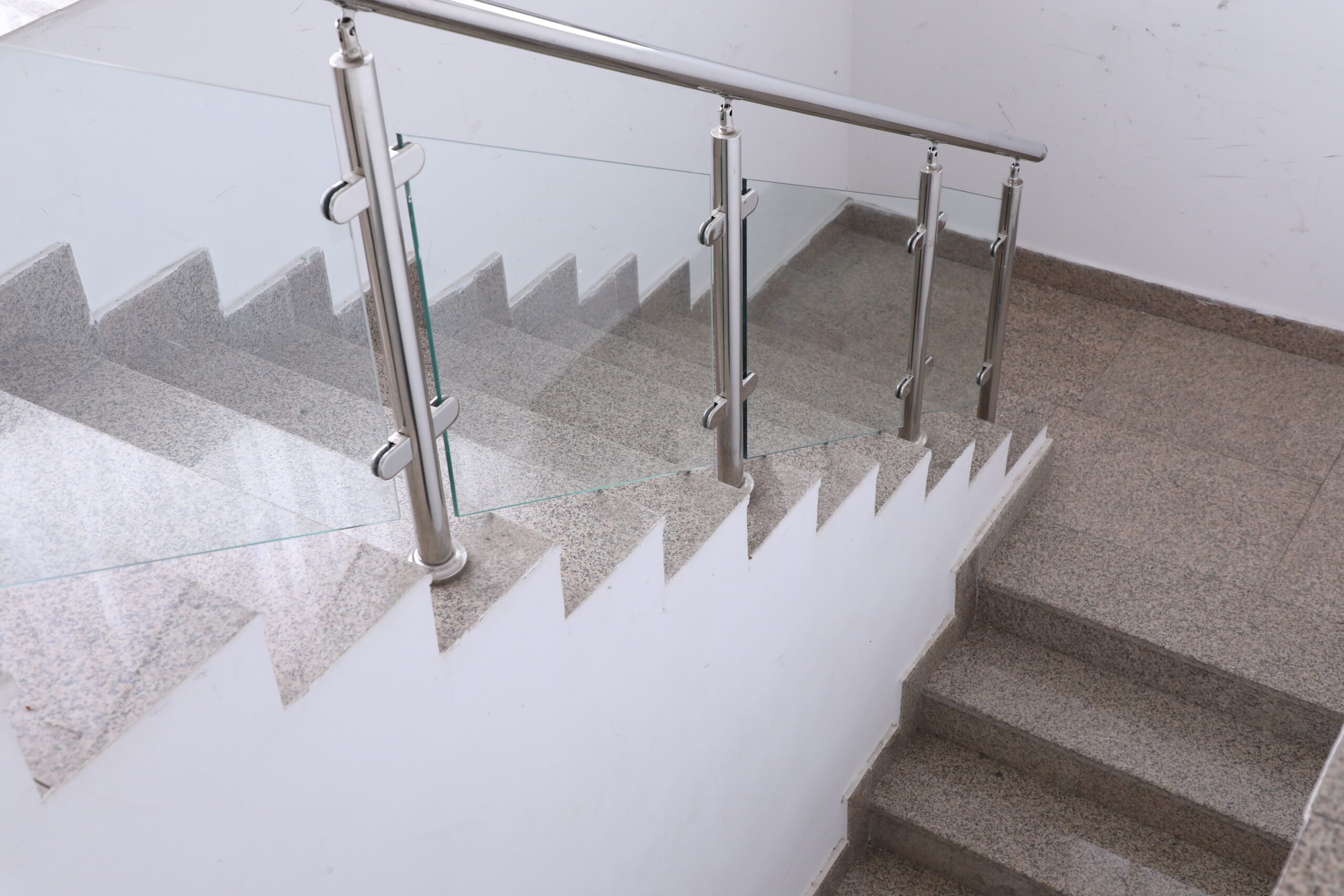 Stainless steel handrails on the stairs in the building