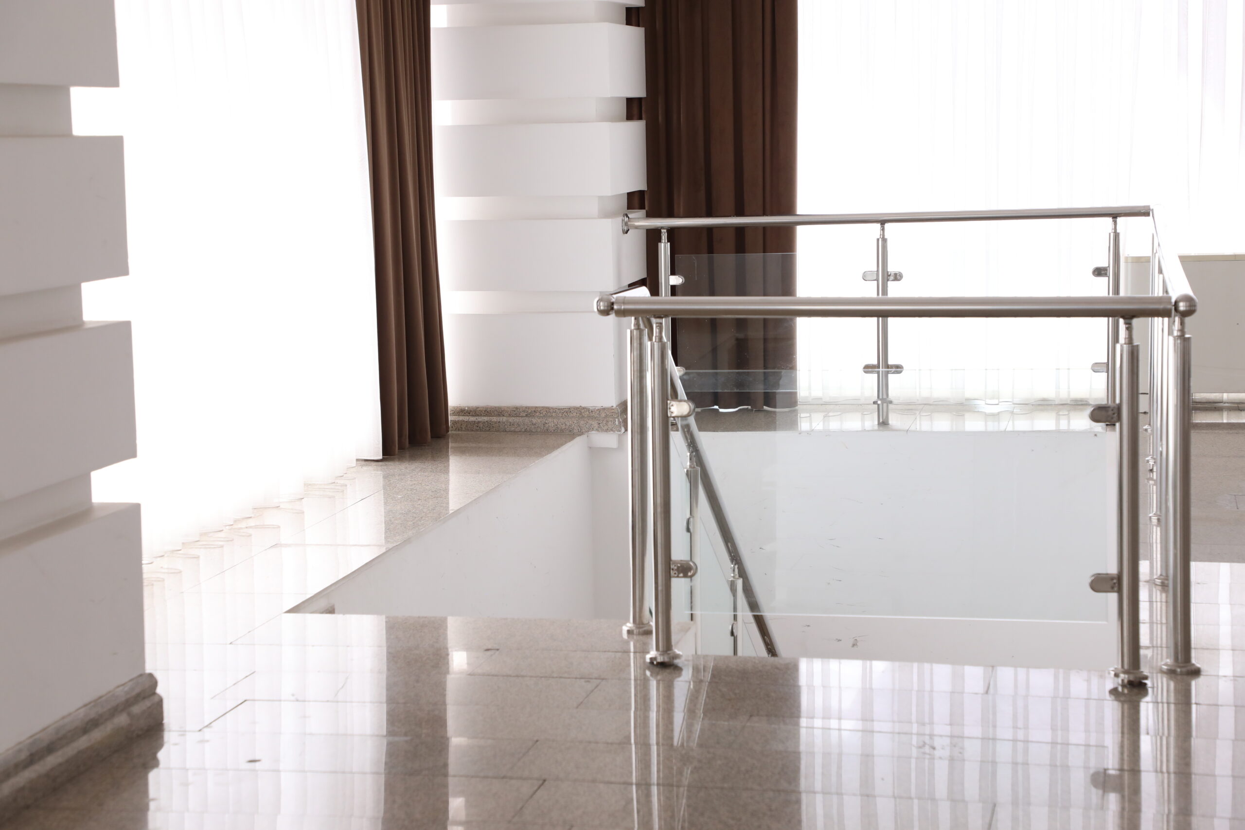 Stainless steel handrails on the stairs in the building