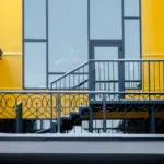 A decorative black iron balcony railing, lightly covered in snow, stands before a modern yellow building featuring large windows and a staircase leading to a door, all framed by brick walls on either side. Glacier_Glass_Regina Glacier_Glass_Regina Glacier_Glass_Regina Glacier_Glass_Regina Glacier_Glass_Regina Glacier_Glass_Regina Glacier_Glass_Regina Glacier_Glass_Regina Glacier_Glass_Regina Glacier_Glass_Regina Glacier_Glass_Regina Glacier_Glass_Regina Glacier_Glass_Regina Glacier_Glass_Regina Glacier_Glass_Regina Glacier_Glass_Regina Glacier_Glass_Regina Glacier_Glass_Regina Glacier_Glass_Regina Glacier_Glass_Regina Glacier_Glass_Regina Glacier_Glass_Regina Glacier_Glass_Regina Glacier_Glass_Regina Glacier_Glass_Regina Glacier_Glass_Regina Glacier_Glass_Regina Glacier_Glass_Regina Glacier_Glass_Regina Glacier_Glass_Regina Glacier_Glass_Regina Glacier_Glass_Regina Glacier_Glass_Regina Glacier_Glass_Regina Glacier_Glass_Regina Glacier_Glass_Regina Glacier_Glass_Regina Glacier_Glass_Regina Glacier_Glass_Regina Glacier_Glass_Regina Glacier_Glass_Regina Glacier_Glass_Regina Glacier_Glass_Regina Glacier_Glass_Regina Glacier_Glass_Regina Glacier_Glass_Regina Glacier_Glass_Regina Glacier_Glass_Regina Glacier_Glass_Regina Glacier_Glass_Regina Glacier_Glass_Regina Glacier_Glass_Regina Glacier_Glass_Regina Glacier_Glass_Regina Glacier_Glass_Regina Glacier_Glass_Regina Glacier_Glass_Regina Glacier_Glass_Regina Glacier_Glass_Regina Glacier_Glass_Regina Glacier_Glass_Regina Glacier_Glass_Regina Glacier_Glass_Regina Glacier_Glass_Regina Glacier_Glass_Regina Glacier_Glass_Regina Glacier_Glass_Regina Glacier_Glass_Regina Glacier_Glass_Regina Glacier_Glass_Regina Glacier_Glass_Regina Glacier_Glass_Regina Glacier_Glass_Regina Glacier_Glass_Regina Glacier_Glass_Regina Glacier_Glass_Regina Glacier_Glass_Regina Glacier_Glass_Regina Glacier_Glass_Regina Glacier_Glass_Regina Glacier_Glass_Regina Glacier_Glass_Regina Glacier_Glass_Regina
