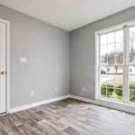 This image features an empty room with light grey walls, a white door, a large multi pane window overlooking a street with houses and trees, and a floor made of dark wood planks. Glacier_Glass_Regina Glacier_Glass_Regina Glacier_Glass_Regina Glacier_Glass_Regina Glacier_Glass_Regina Glacier_Glass_Regina Glacier_Glass_Regina Glacier_Glass_Regina Glacier_Glass_Regina Glacier_Glass_Regina Glacier_Glass_Regina