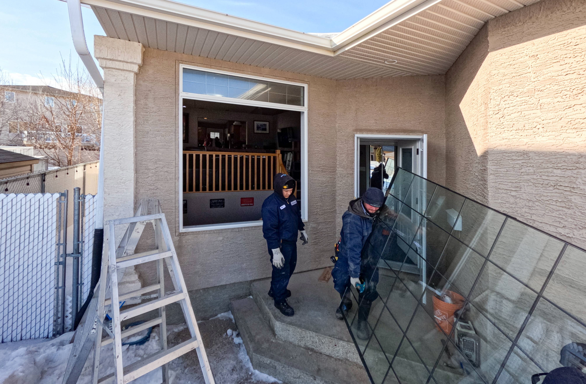 Glacier Glass team carrying out a window during a window replacement (1920×1260) Window Replacement in Regina by Glacier Glass